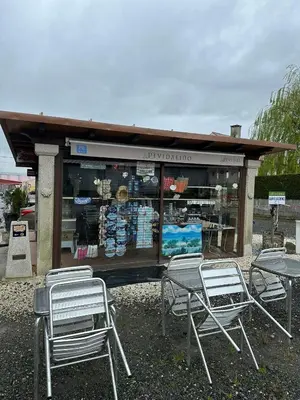 a group of chairs and tables in front of a store at P Residencia PIVIDAL in Picaraña