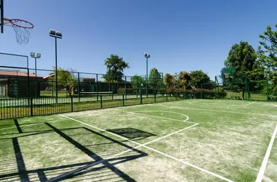 a tennis court with a net on top of it at Pazo de Eidian in Eidián
