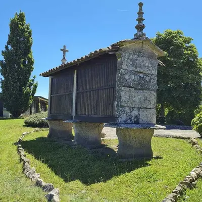 a small church sitting on top of a stone monument at Pazo de Eidian in Eidián