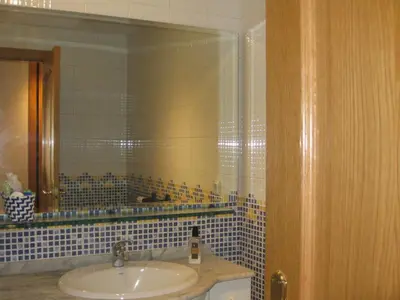 a bathroom with a sink and a mirror at Descanso do Sar in Santiago de Compostela