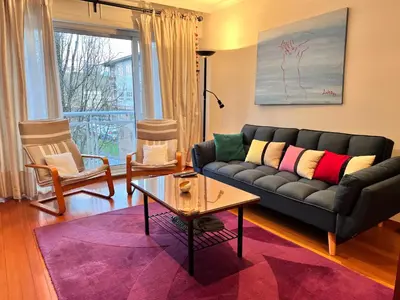 a living room with a couch and a table at Descanso do Sar in Santiago de Compostela