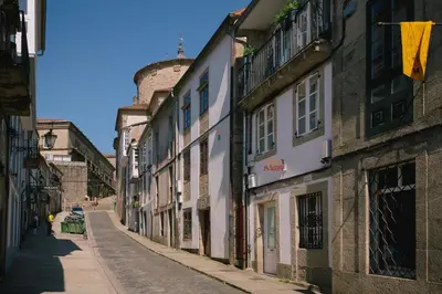 an empty street in an old town with buildings at roomPEDRA apartamentos turísticos in Santiago de Compostela