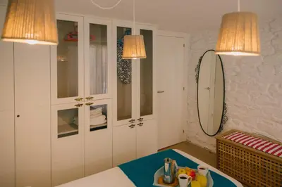 a room with two lamps and a tray of food on a table at roomPEDRA apartamentos turísticos in Santiago de Compostela