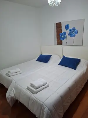 a room with two bunk beds and a table at Apartahotel portal de leon in Caboalles de Abajo