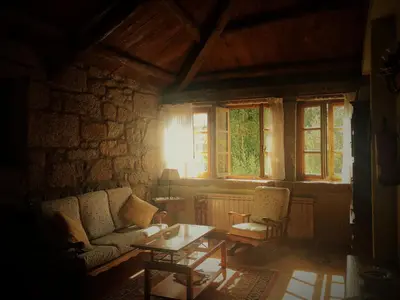 a living room with a couch and a table at Finca Galea in Carballido
