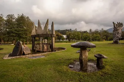 a garden with mushrooms in a grass field at Finca Galea in Carballido