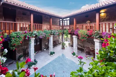 an outdoor patio with flowers on a building at Pazo de Esposende in Esposende