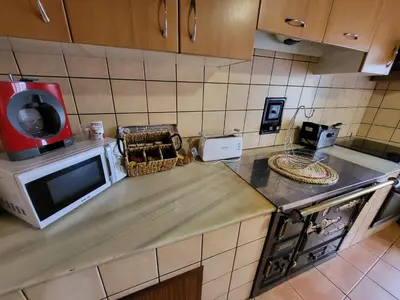 a kitchen with a microwave and a counter top at Casa Maral in Pontevedra