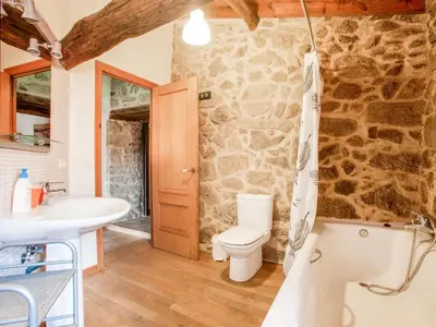 a bathroom with a toilet and a sink at Holiday Home in Castrotañe near Sil Cañon in Castillón