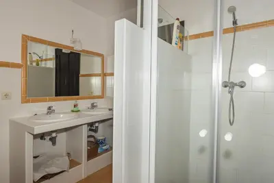 a bathroom with a shower and a sink and a mirror at Casona Las Burillas in Villar de los Barrios