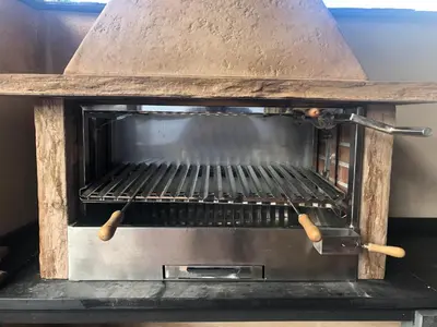 a stove top oven with a metal top at Casona Las Burillas in Villar de los Barrios