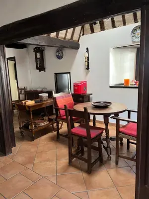 a dining room with a table and chairs at Casona Las Burillas in Villar de los Barrios