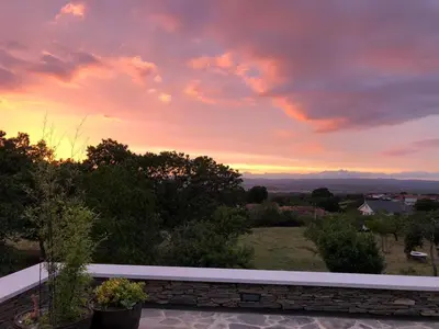 a view of a sunset from a balcony at Casa Pro Pantea in Monforte de Lemos