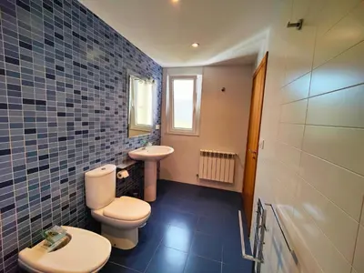 a bathroom with a toilet and a sink at Casa-Nova 2 in Sarria