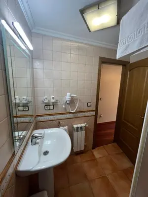 a bathroom with a shower and a toilet and a sink at Casa Alberto in Castro Caldelas