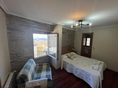 a bathroom with a sink and a window at Casa Alberto in Castro Caldelas
