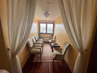 a bedroom with a large bed with pink pillows at Casa Alberto in Castro Caldelas