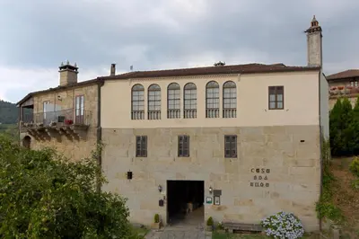 an old stone building with a large doorway at Casa dos Ulloa in Esposende