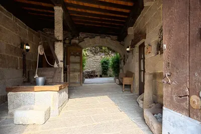 an entrance to a stone building with an archway at Casa dos Ulloa in Esposende