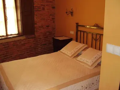 a bedroom with a bed with two pillows on it at Casa dos Ulloa in Esposende