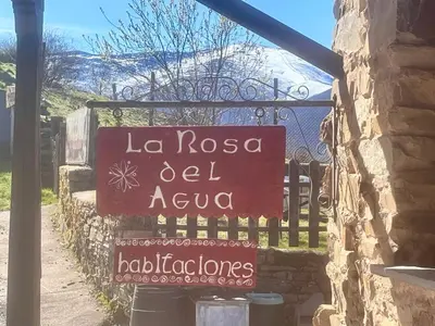 a sign that reads la rosa el ayula on a fence at La Rosa del Agua in El Acebo de San Miguel