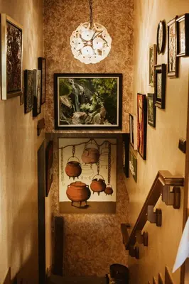 a hallway with a wall with pictures on the wall at Casa da Capilla in Gres