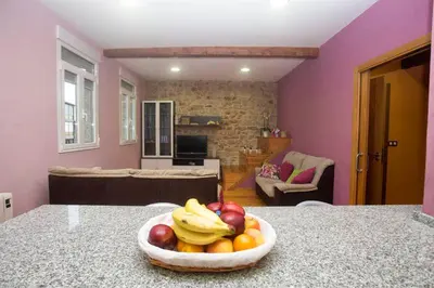 a bowl of fruit on a counter in a kitchen at A Casa do Avó in Palas de Rei