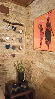a room with a wall with a painting and a table at Casa Santiago in Currelos