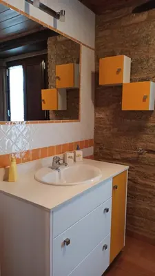 a bathroom with a sink and a mirror at Casa Santiago in Currelos