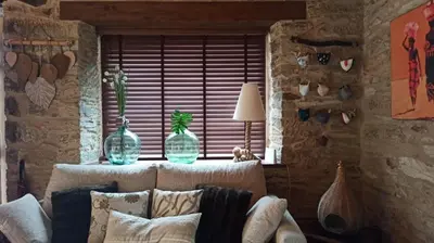 a living room with a couch and a window at Casa Santiago in Currelos