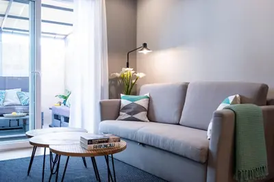 a living room with a couch and a table at Apartamento de diseño centrico con terraza espectacular in Santiago de Compostela