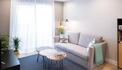 a living room with a couch and a table at Apartamento de diseño centrico con terraza espectacular in Santiago de Compostela