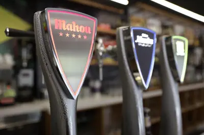 a row of metal parking meters in a store at CASA CINES in Lugo