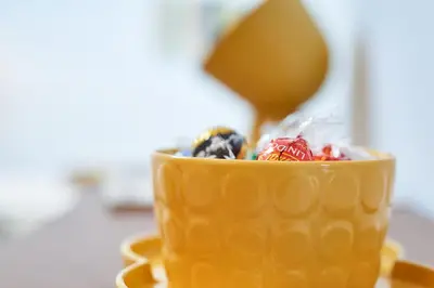a yellow coffee cup with a spoon in it at Berce in Arzúa
