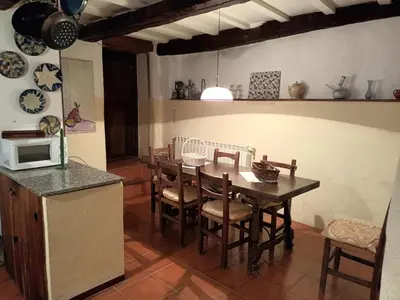 a kitchen and dining room with a table and chairs at Palacio de Cantiz 
