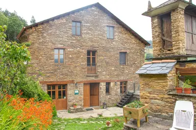 a large stone house with a yard at Casa Rural Norita - Adults only in Lourenzá