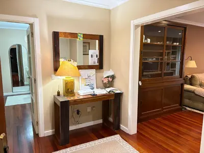 a home office with a desk and a lamp at Home Sweet Home in Caldas de Reis