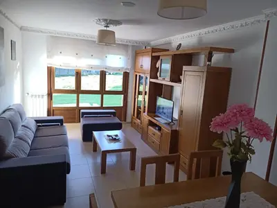 a living room with a couch and a table at Sandino 32 in Santiago de Compostela