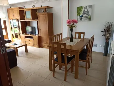 a kitchen and dining room with a table and chairs at Sandino 32 in Santiago de Compostela