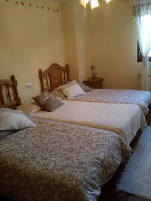 two beds sitting next to each other in a bedroom at Casa Rural Las Nieves in San Ciprián