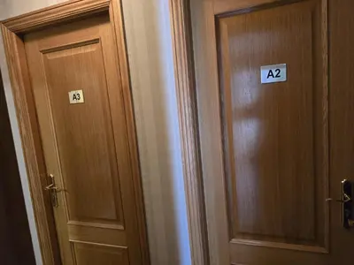 two doors with numbers on them next to each other at Noja rooms 2 in O Pedrouzo