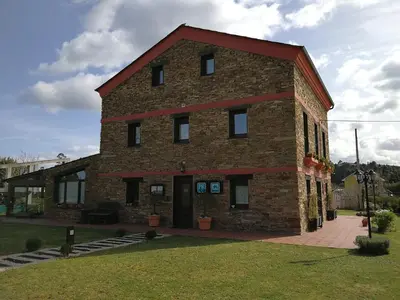 a large brick building with a red roof at A Lume Manso - Adults Only in Barreiros
