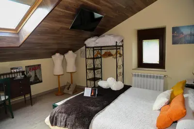 a bedroom with a bed in a attic at A Lume Manso - Adults Only in Barreiros