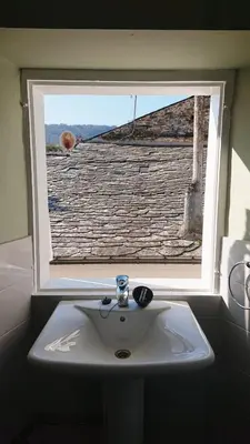 a white sink in front of a window at Camino de Estrellas Mondoñedo Lugo in Mondoñedo