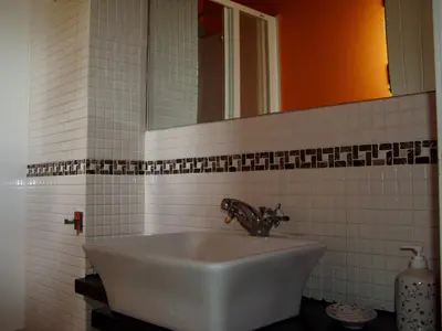 a bathroom with a sink and a mirror at Casiña de Folgosa in Ribadeo