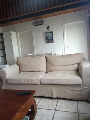 a white couch in a living room with a table at Casiña de Folgosa in Ribadeo