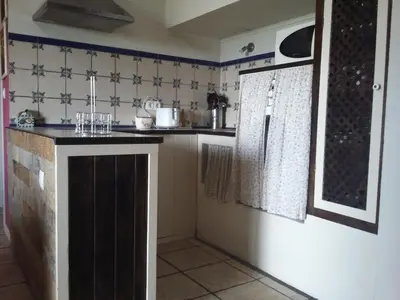 a kitchen with a counter in a room at Casiña de Folgosa in Ribadeo