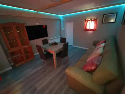 a living room with a couch and a table at Casa Dana in Santiago de Compostela
