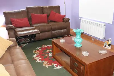 a living room with a couch and a coffee table at Casa Dana in Santiago de Compostela