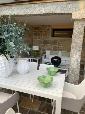 a white table with bowls on top of it at Casa Herreria in Caldas de Reis